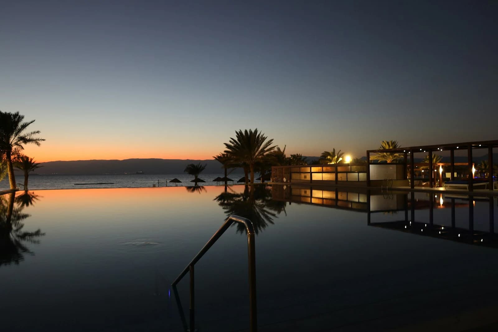 Infinity pool at dusk overlooking ocean